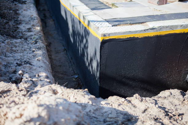 Professional Waterproofing technician working in Cambridge City, IN